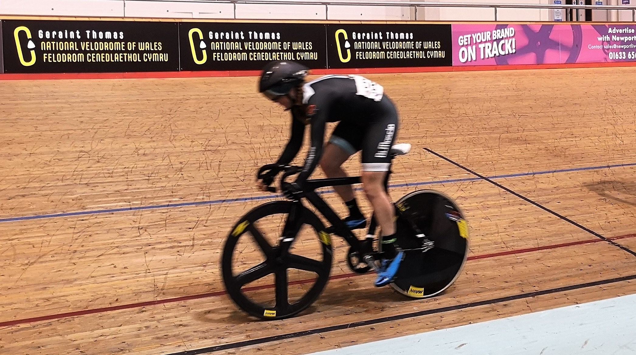 Cyclist on a track in compression outfit